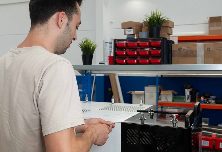 Hydros Power engineer assembling STELION Booster Station during series production